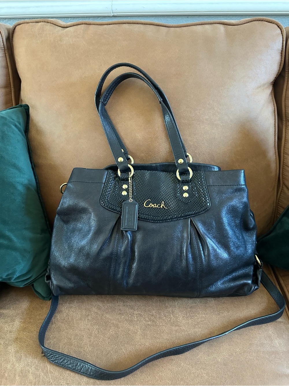 Coach Black Leather Shoulder bag with Gold Hardware and crossbody strap.